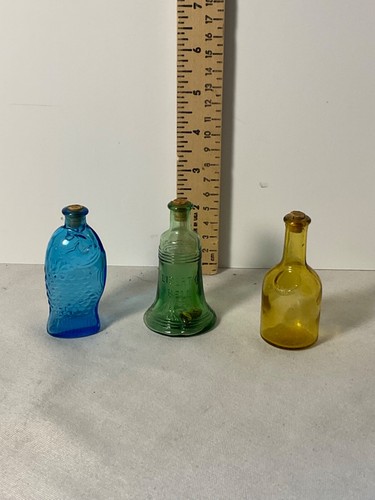 Three miniature glass bottles