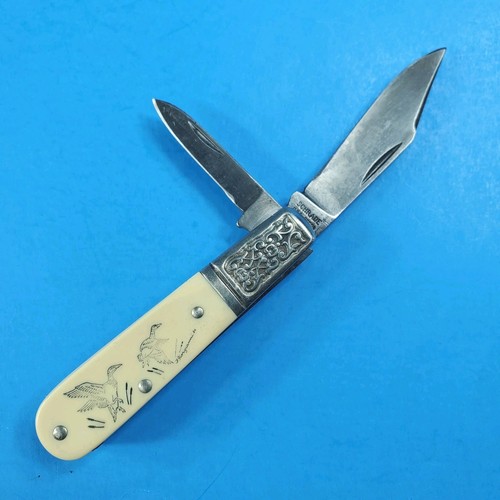 Schrade scrimshaw ducks two - scrimshaw,