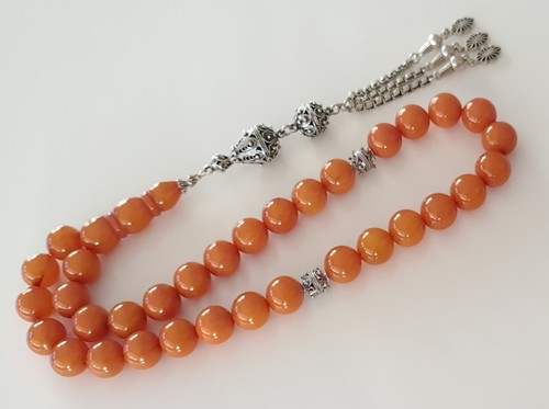 Amber bakelite prayer - bakelite,
