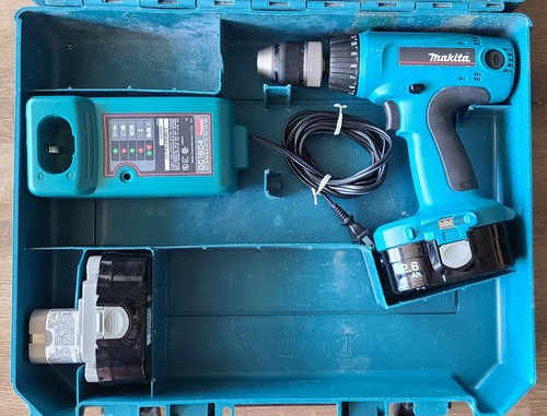 Makita 6347d drill - with, two