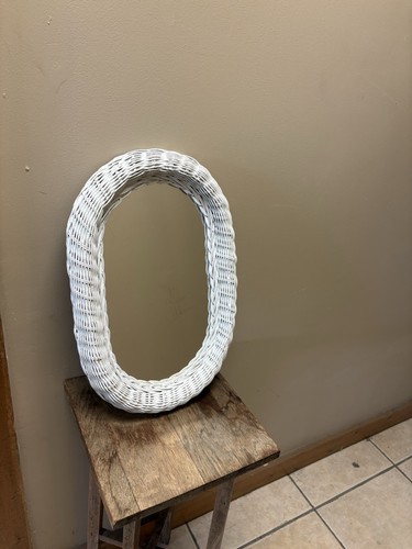 Vintage wicker framed oval