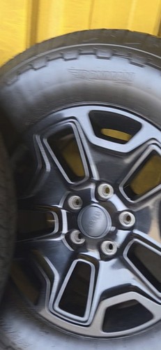 Wheels and tires off jeep - and,
