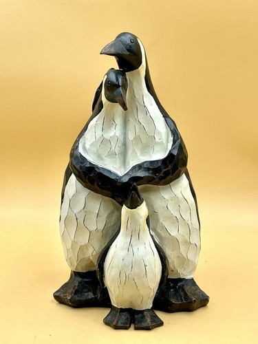 Hugging penguin family mother