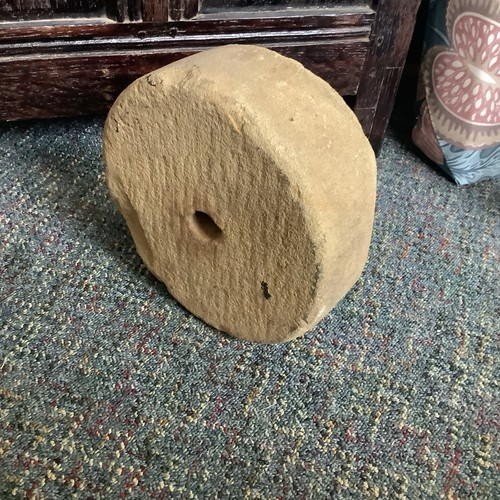Antique millstone grinding - millstone,
