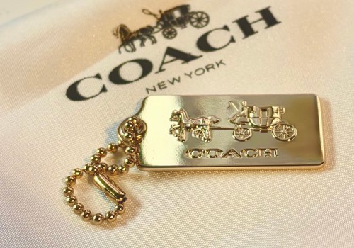 Coach gold tone metal heritage - coach,