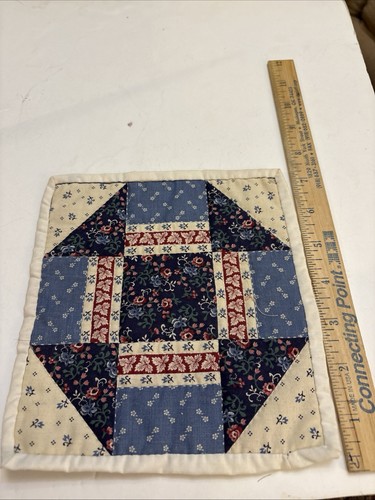 Miniature hand quilted doll