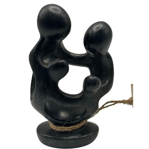 Hand carved black stone family - hand,