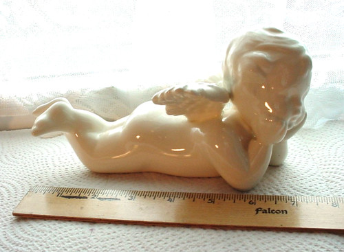 Ceramic pondering cupid - ceramic,