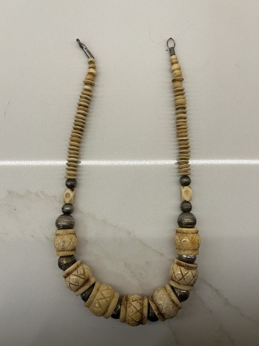 Carved cow bone mid - , chest