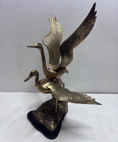 Vintage brass cranes flight - cranes, in