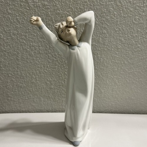 Lladro figurine boy yawning - lladro,