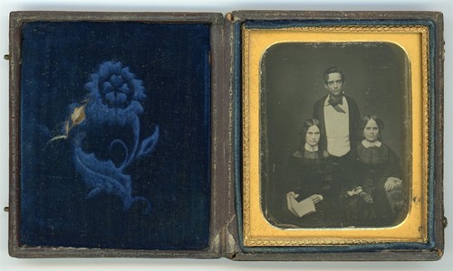 Young man two seated women - seated,