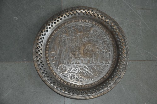 Old brass handcrafted welcome - old,