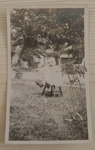 1918 cute baby sitting - sitting, wooden