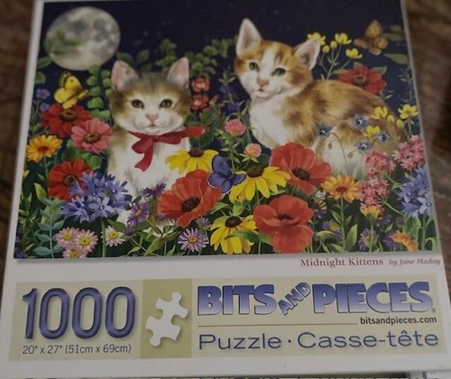 Two cat jigsaw puzzles bits - cat,