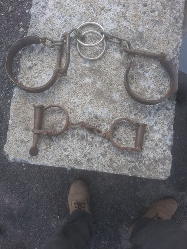 Old leg shackles and antique - shackles,