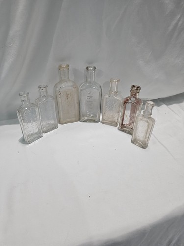 Vintage clear glass bottles - 7,