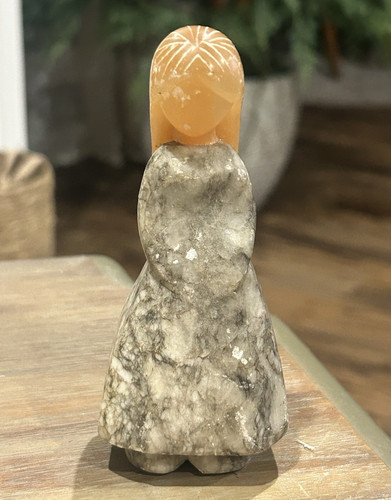 Hand carved stone woman - hand,