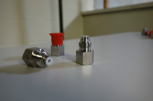 Outlet check valve for - , perkin