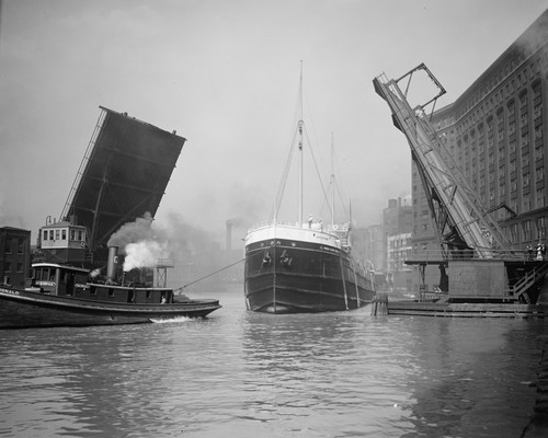 Tugboat towing ship - , near