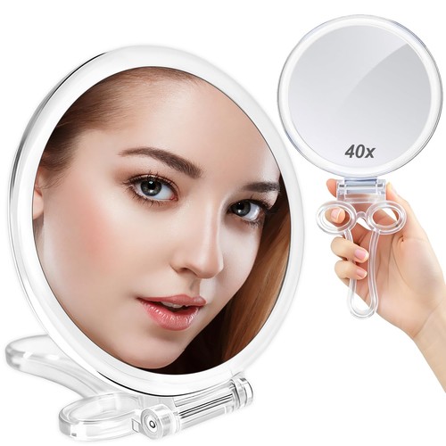 Magnifying hand mirrors with - hand,
