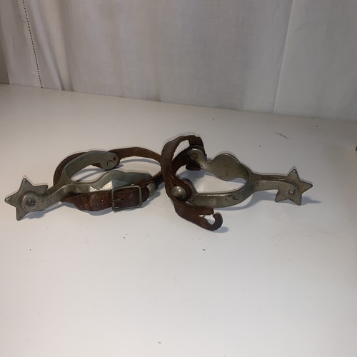 Antique cowboy spurs - with, star