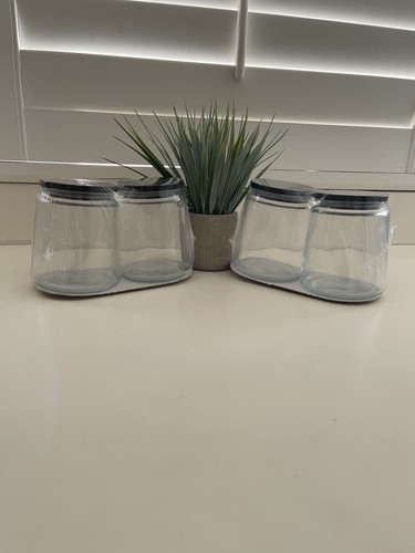 Two glass jars with black - with,