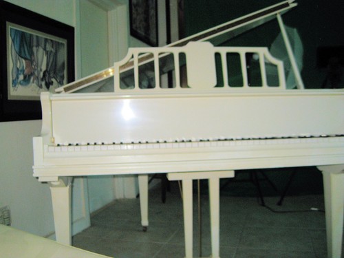 Used white baby grand piano