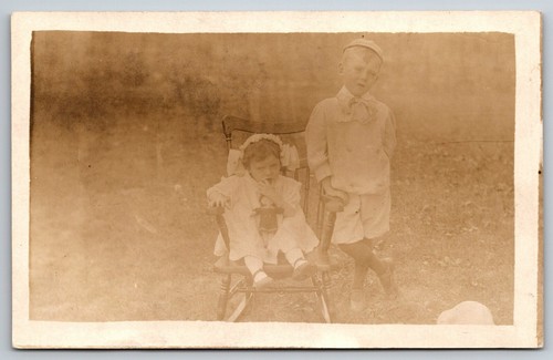 Antique rppc little girl - little, toy