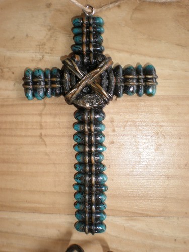 Turquoise cross designed with - cross,