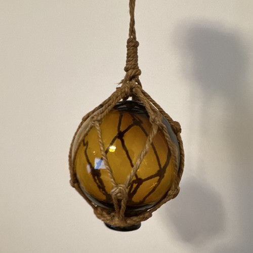 Amber glass fishing float - glass,
