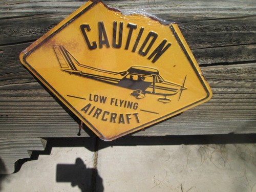 Caution low flying - caution, aircraft