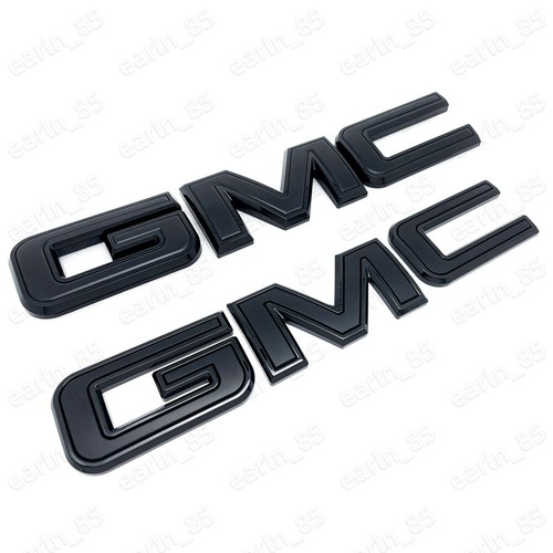 New front rear emblem - &, black