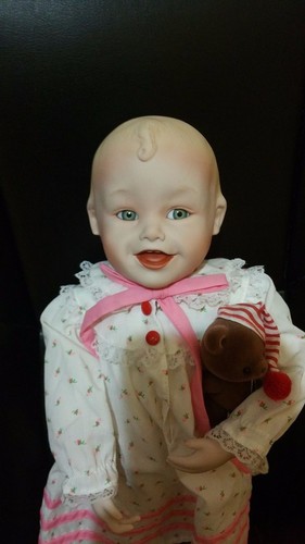 Porcelain doll artist - by,