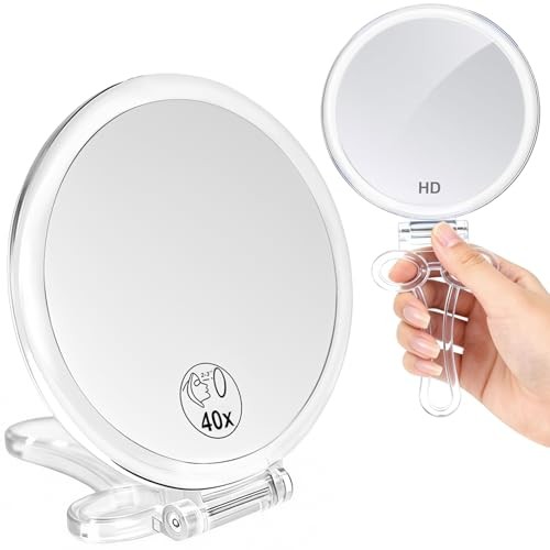 Magnifying hand mirrors with - hand,