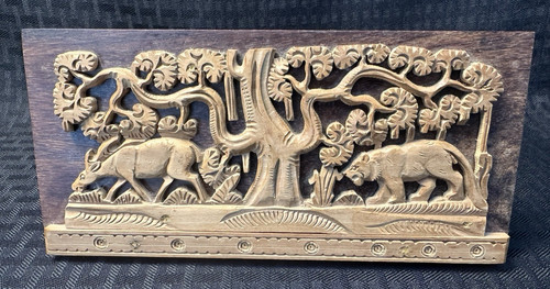 Hand carved teak - wood, jungle