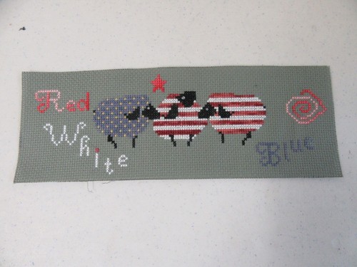Finished cross stitch - cross, july
