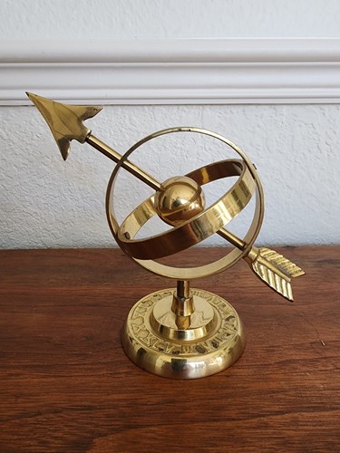Armillary sphere with arrow - armillary,