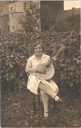 Rppc european woman playing - woman,