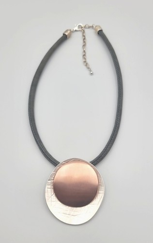 Copper silver tone disc - &,