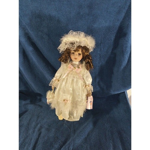 Porcelain doll wearing pink - doll,