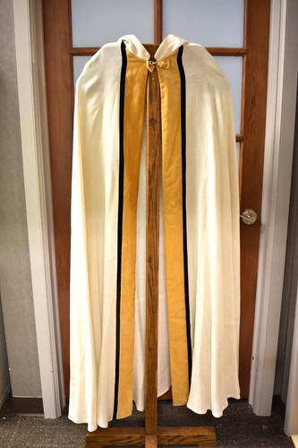 Used white and gold hooded - and,