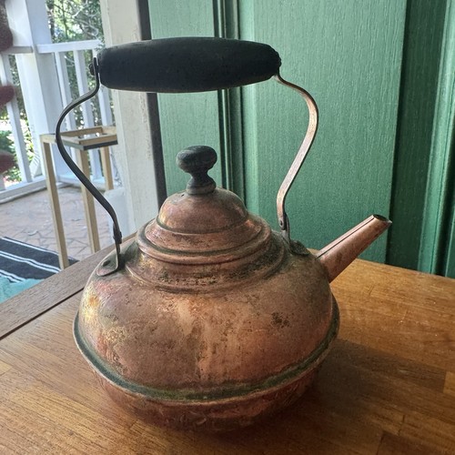 Antique copper tea kettle with - tea,