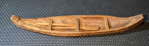 Hand carved wooden canoe lands - carved,