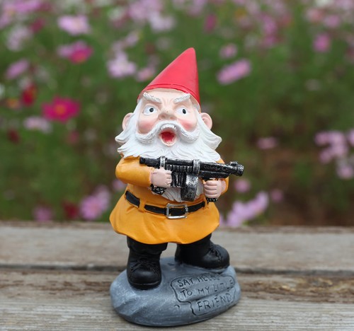 Funny garden gnome with - garden, gun
