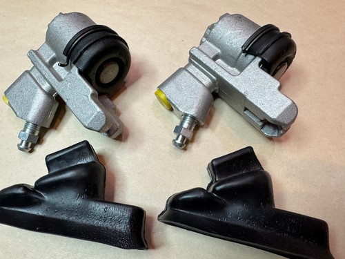 Pair rear wheel cylinders - of,