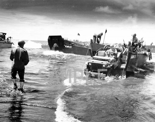 Landing craft unloads - landing, jeep
