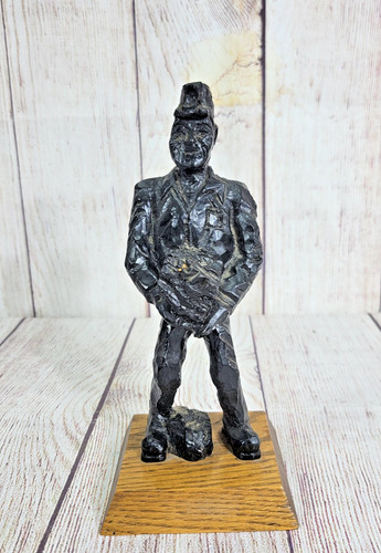 Vintage hand crafted coal - hand,