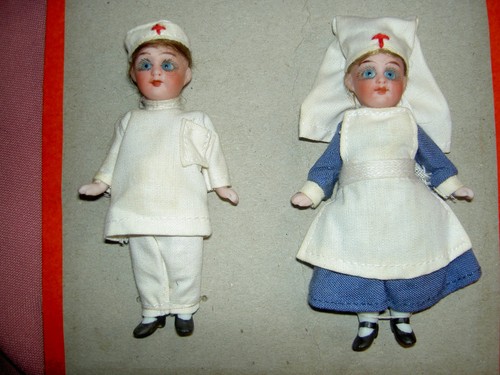 Two antique bisque - two,