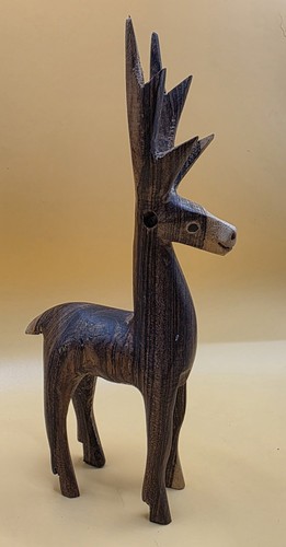 Hand carved wooden deer - hand,